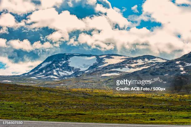 scenic view of snowcapped mountains against sky - acb stock pictures, royalty-free photos & images