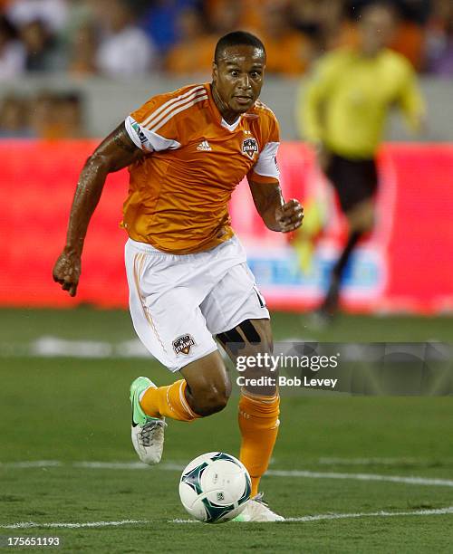 Ricardo Clark of Houston Dynamo rushes the ball up the field against the Columbus Crew at BBVA Compass Stadium on August 3, 2013 in Houston, Texas.