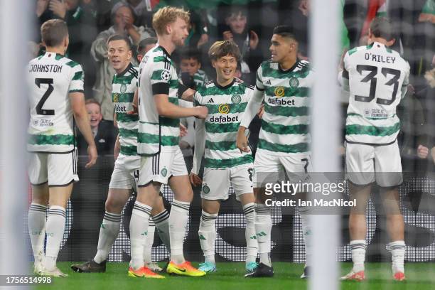 Kyogo Furuhashi of Celtic celebrates with teammates after scoring the team's first goal during the UEFA Champions League match between Celtic FC and...
