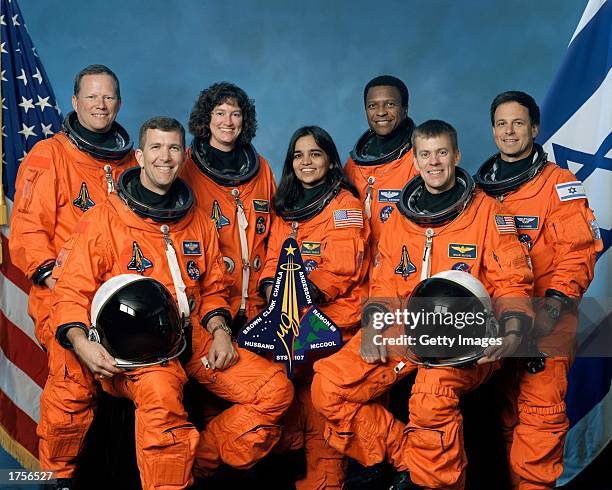 The crew of Space Shuttle Columbia's mission STS-107 take a break from their training regime to pose for the traditional crew portrait. Seated in...