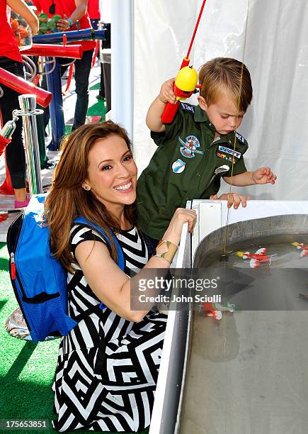 Actress Alyssa Milano and son Milo Thomas Bugliari at the world-premiere of "Disney's Planes" presented by Target at the El Capitan Theatre on August...