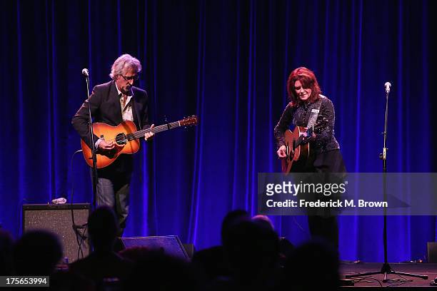 Recording artists John Leventhal and Rosanne Cash perform onstage during the "Nashville 2.0" presentation at the PBS portion of the 2013 Summer...