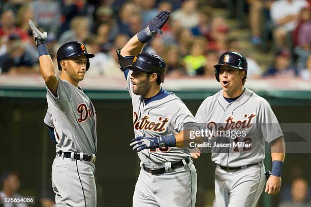 Jose Iglesias celebrates with Alex Avila and Andy Dirks of the Detroit Tigers after Avila hit a three run home run during the ninth inning against...