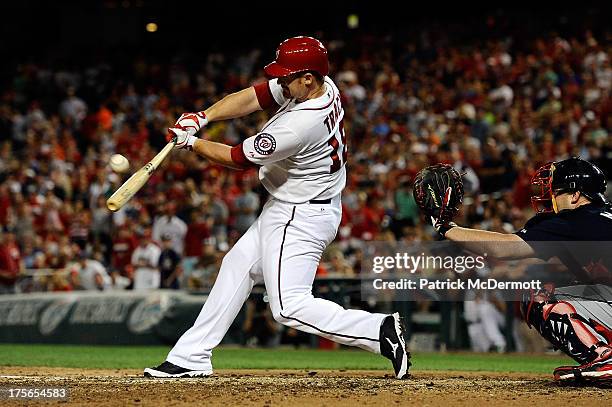 Chad Tracy of the Washington Nationals flies out in the ninth inning against the Atlanta Braves for the final out of the game at Nationals Park on...