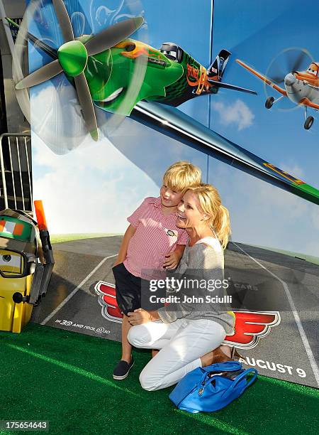 Actress Julie Bowen and Oliver McLanahan Phillips at the world-premiere of "Disney's Planes" presented by Target at the El Capitan Theatre on August...