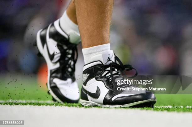 Nick Bosa of the San Francisco 49ers wears cleats as he warms up before the game against the Minnesota Vikings at U.S. Bank Stadium on October 23,...