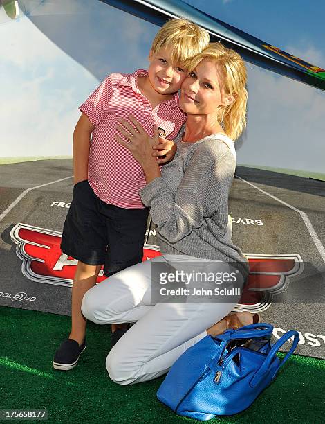 Actress Julie Bowen and Oliver McLanahan Phillips at the world-premiere of "Disney's Planes" presented by Target at the El Capitan Theatre on August...