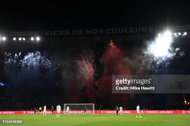 General view inside the stadium as fans of Paris Saint-Germain use pyrotechnic devices during the UEFA Champions League match between Paris...