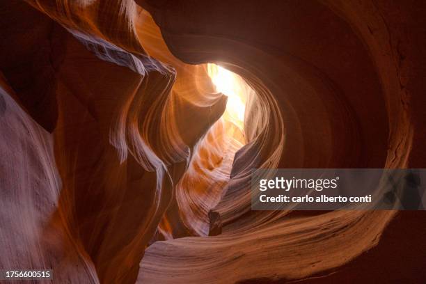 a visit of the lower antelope canyon during a summer sunny day, page, arizona, united states of america - slot canyon stock pictures, royalty-free photos & images