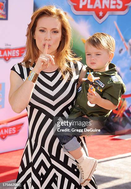 Actress Alyssa Milano and son Milo Thomas Bugliari arrive at the Los Angeles premiere of "Planes" at the El Capitan Theatre on August 5, 2013 in...