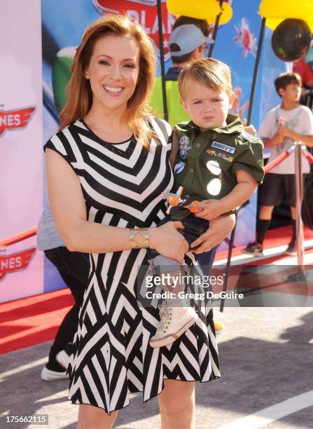 Actress Alyssa Milano and son Milo Thomas Bugliari arrive at the Los Angeles premiere of "Planes" at the El Capitan Theatre on August 5, 2013 in...