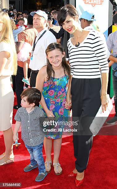 Catherine Bell, Gemma Beason and Ronan Beason attend the Disney's "Planes" Los Angeles premiere held at the El Capitan Theatre on August 5, 2013 in...