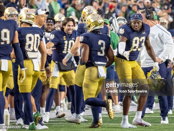 Notre Dame Fighting Irish quarterback Sam Hartman celebrates with his teammates during the college football game between the Pittsburgh Panthers and...
