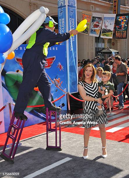 Actress Alyssa Milano and son Milo Thomas Bugliari arrive at the premiere of Disney's 'Planes' presented by Target at the El Capitan Theatre on...