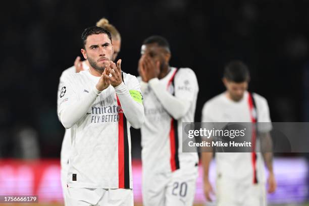 Davide Calabria of AC Milan looks dejected as he shows appreciation to the fans at full-time following their team's defeat in the UEFA Champions...