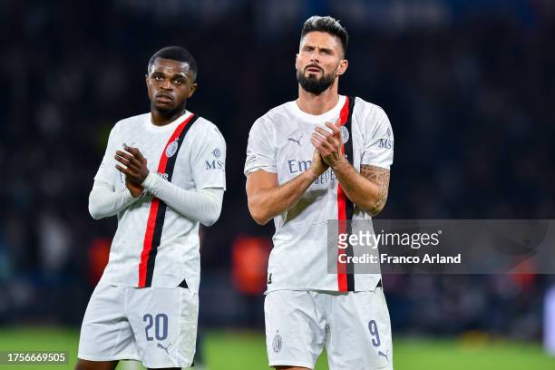 Olivier Giroud and Pierre Kalulu of AC Milan look dejected at full-time following during the UEFA Champions League match between Paris Saint-Germain...