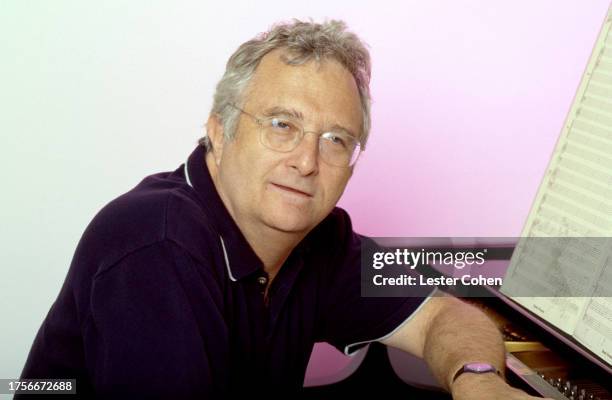 American singer Randy Newman poses for a portrait next to his piano at his home in Los Angeles, California, circa 1994.