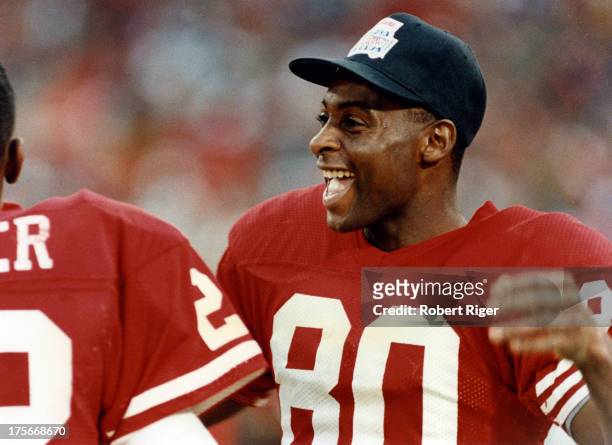 Jerry Rice of the San Francisco 49ers laughs on the sidelines during the 1990 Super Bowl XXIV against the Denver Broncos on January 28, 1990 at the...