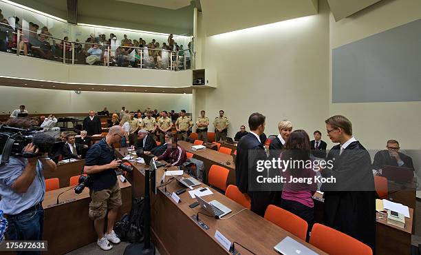 Beate Zschaepe and Andre E wait for the start of day 39 of the NSU neo-Nazi murders trial at the Oberlandesgericht Muenchen courthouse on August 6,...