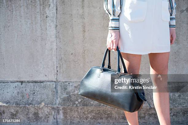 Fashion student Emily Lynch wears a Top Shop dress, bag from E-bay and an ASOS shirt on day 3 of Graduate Fashion week on June 04, 2013 in London,...