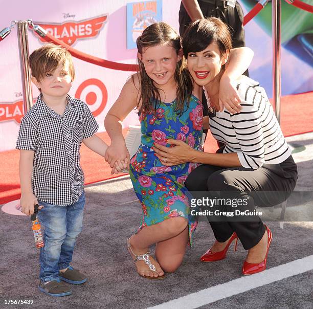 Actress Catherine Bell, son Ronan Beason and daughter Gemma Beason arrive at the Los Angeles premiere of "Planes" at the El Capitan Theatre on August...