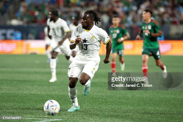 Joseph Paintsil of Ghana dribbles during the first half of their match against México at Bank of America Stadium on October 14, 2023 in Charlotte,...