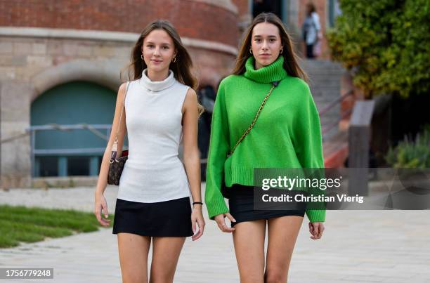 Guest wears creme white sleeveless turtleneck & a guest wears green turtleneck, black mini skirt on day 2 of 080 Barcelona Fashion 2023 at Recinte...