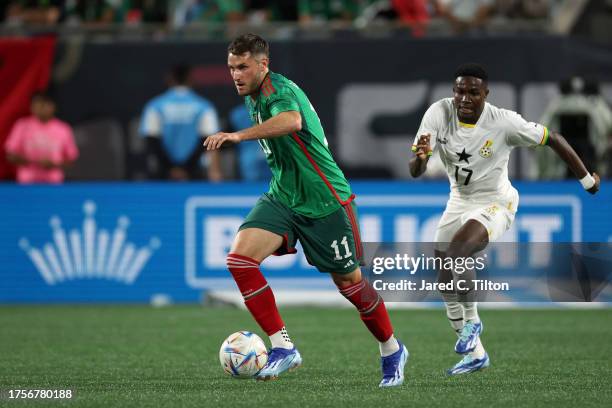 Santiago Gimenez of México dribbles during the second half of their match against Ghana at Bank of America Stadium on October 14, 2023 in Charlotte,...