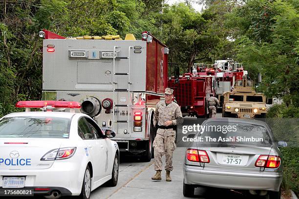 Military firefighting trucks arrive on siteafter a U.S. Helicopter crashed in the mountain on August 5, 2013 in Ginoza, Okinawa, Japan. The...