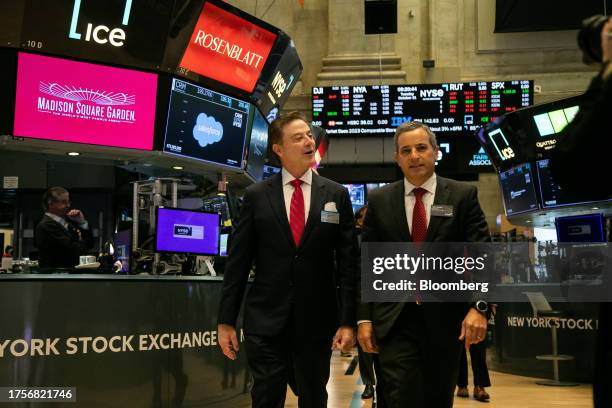 Rick Pitino, head coach of the St. John's Red Storm basketball team, center left, on the floor of the New York Stock Exchange in New York, US, on...