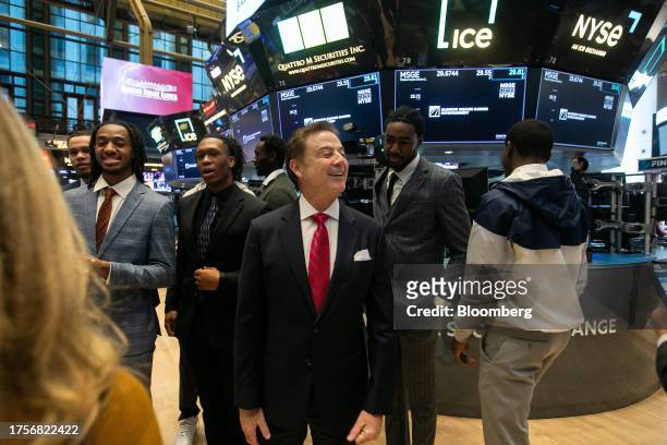 Rick Pitino, head coach of the St. John's Red Storm basketball team, center, on the floor of the New York Stock Exchange in New York, US, on Tuesday,...