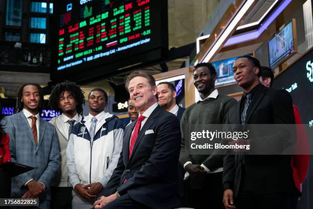 Rick Pitino, head coach of the St. John's Red Storm basketball team, center, at the New York Stock Exchange in New York, US, on Tuesday, Oct. 31,...