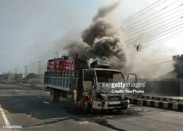 Cargo truck burns on the street after it was torched by garment workers in Shafipur, Gazipur on October 31 during a protest held to demand fair wages...