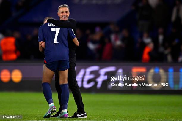 Kylian Mbappe of Paris Saint-Germain is congratulated by coach Luis Enrique after the UEFA Champions League match between Paris Saint-Germain and AC...