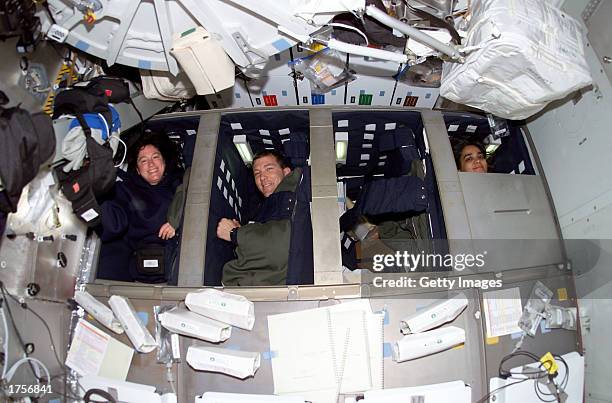 Astronauts Laurel B. Clark, Rick D. Husband and Kalpana Chawla, Space Shuttle Columbia STS-107 mission specialist, mission commander and mission...