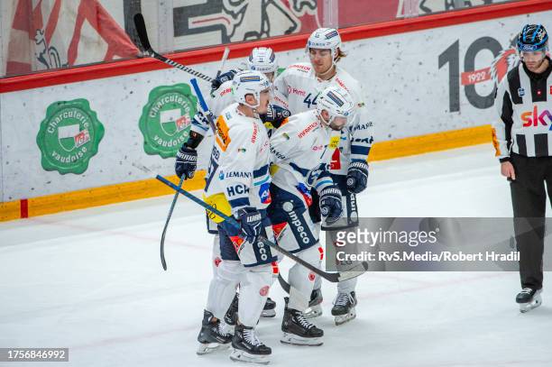 Jesse Virtanen of HC Ambri-Piotta celebrates his goal with teammates during the National League match between Lausanne HC and HC Ambri-Piotta at...