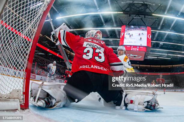 Jesse Virtanen of HC Ambri-Piotta scores a goal against Goalie Kevin Pasche of Lausanne HC during the National League match between Lausanne HC and...