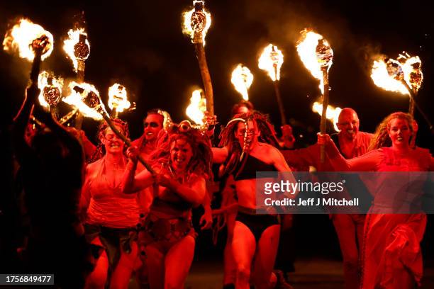 Members of the Beltane Fire Society take part in Samhuinn Fire Festival on October 31, 2023 in Edinburgh, United Kingdom. Once celebrated from...