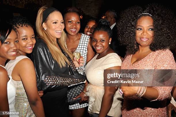 Actors Mariah Carey and Oprah Winfrey pose with guests at Lee Daniels' "The Butler" New York premiere, hosted by TWC, DeLeon Tequila and Samsung...