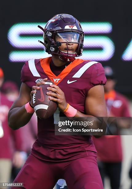 Virginia Tech Hokies Quarterback Kyron Drones surveys the field for an open receiver from the pocket during a college football game between the Wake...