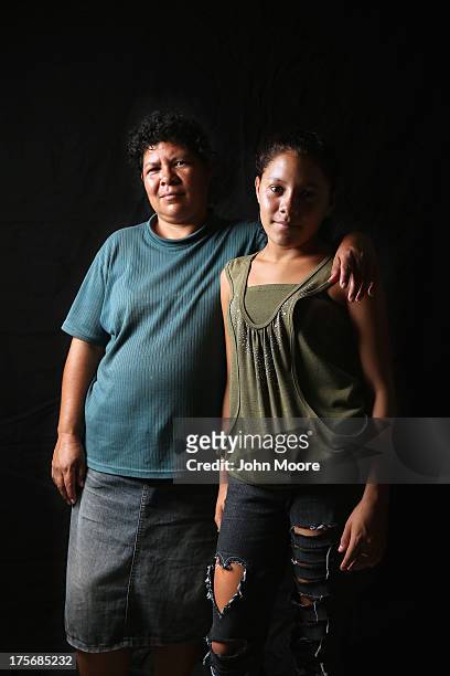Salvadorian immigrant Consuelo Miscuita and her daughter Wendy spend another night at the Hermanos en el Camino immigrant shelter on August 5, 2013...