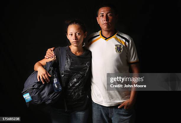 Genenis Yamileht and her husband Jose Natanael from El Salvador, spend a night at the Hermanos en el Camino immigrant shelter on August 5, 2013 in...