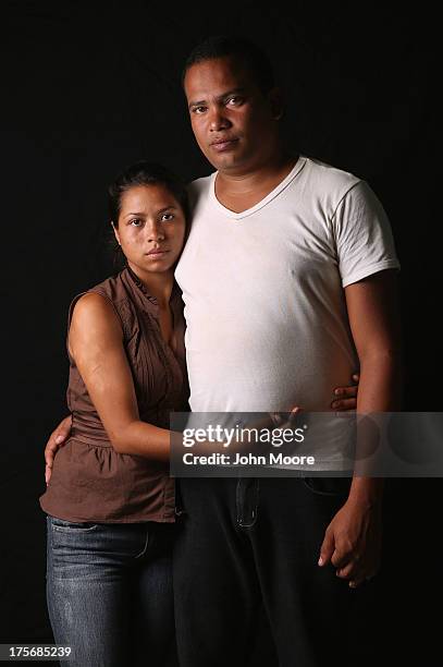 Honduran immigrant Delris Siomara and her husband Rolando from Cuba spend a night at the Hermanos en el Camino immigrant shelter on August 5, 2013 in...