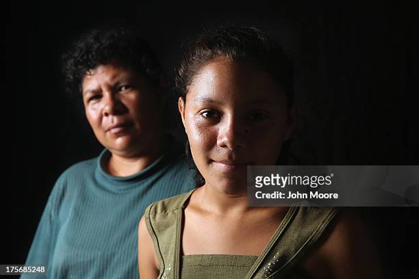 Salvadorian immigrant Consuelo Miscuita and her daughter Wendy spend another night at the Hermanos en el Camino immigrant shelter on August 5, 2013...