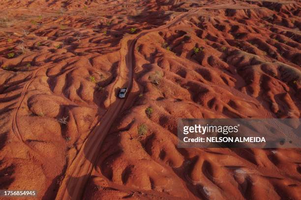 Aerial view showing a car riding along a dirt road in the Desert of Gilbues, in Gilbues, in the northeastern state of Piaui, Brazil, taken on...