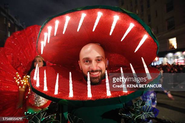 Man dressed as a carnivorous plant attends the Annual Village Halloween parade in New York on October 31, 2023.