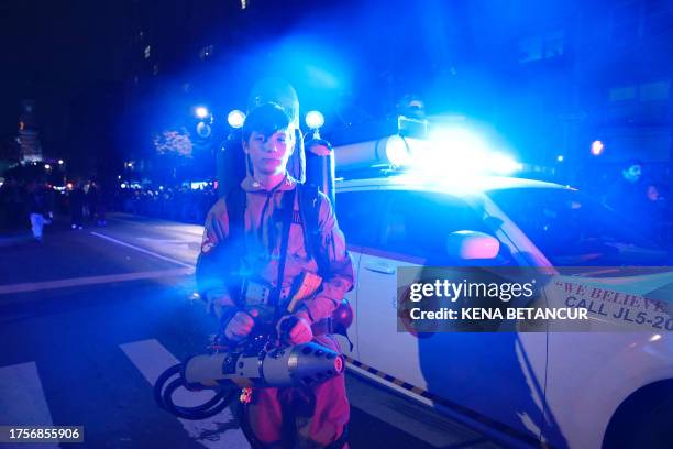 Young man dressed as a character from Ghostbusters attends the Annual Village Halloween parade in New York on October 31, 2023.