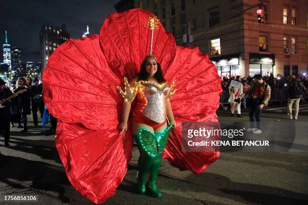 Revelers dance during the Annual Village Halloween parade in New York on October 31, 2023.