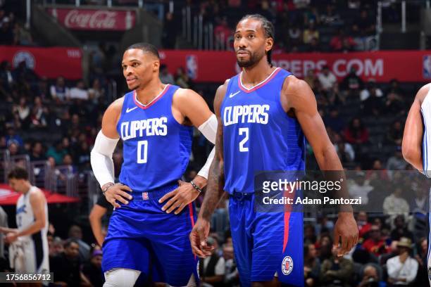 Russell Westbrook of the LA Clippers and Kawhi Leonard of the LA Clippers looks on during the game against the Orlando Magic on October 31, 2023 at...