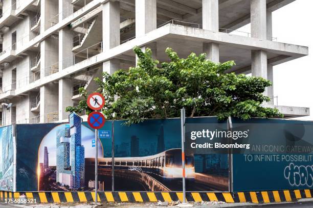 An advertising banner outside a building under construction in Ho Chi Minh, Vietnam, on Saturday, Oct. 28, 2023. Ho Chi Minh City's first-quarter...